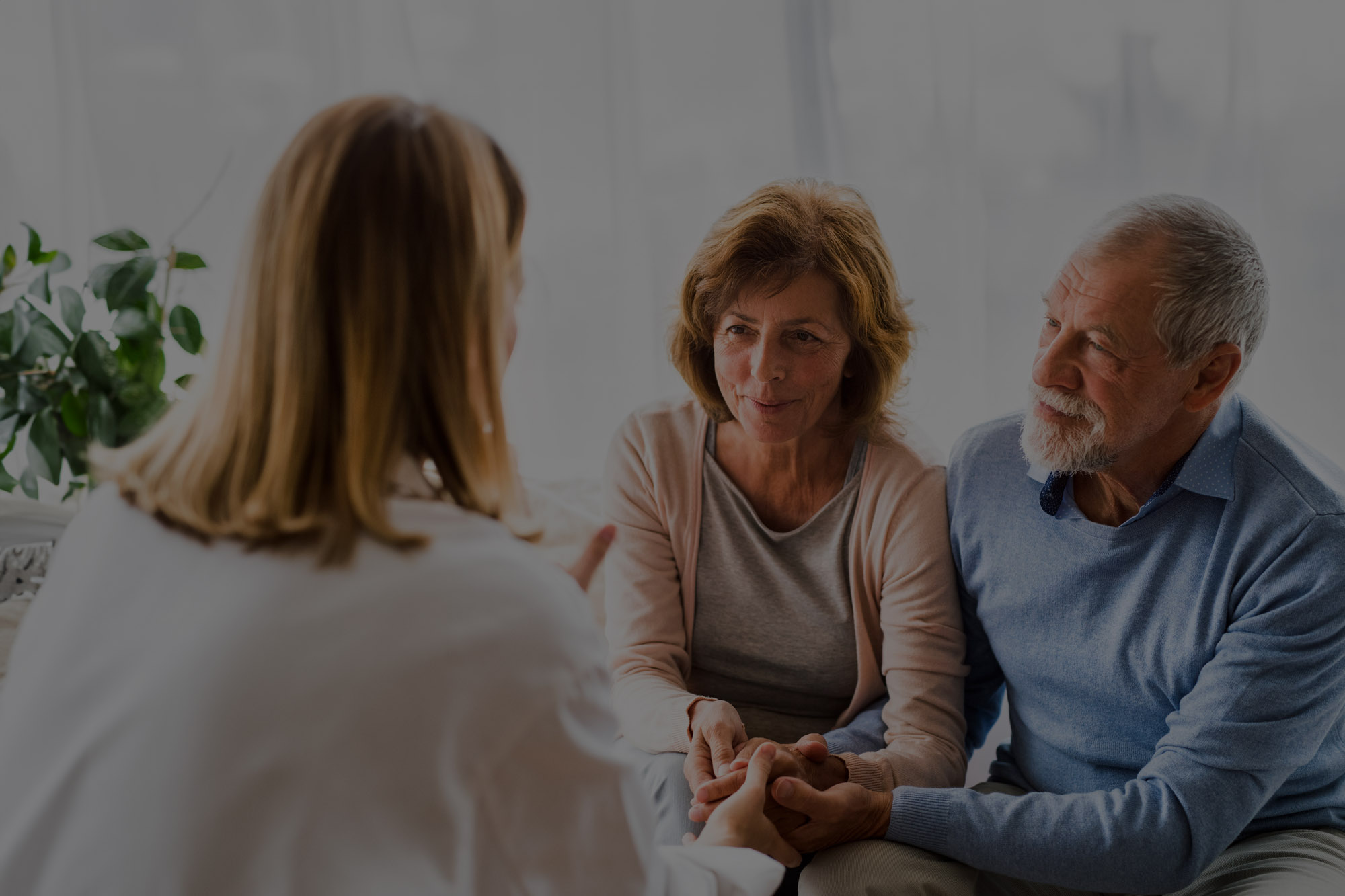 Couple talking to their doctor.