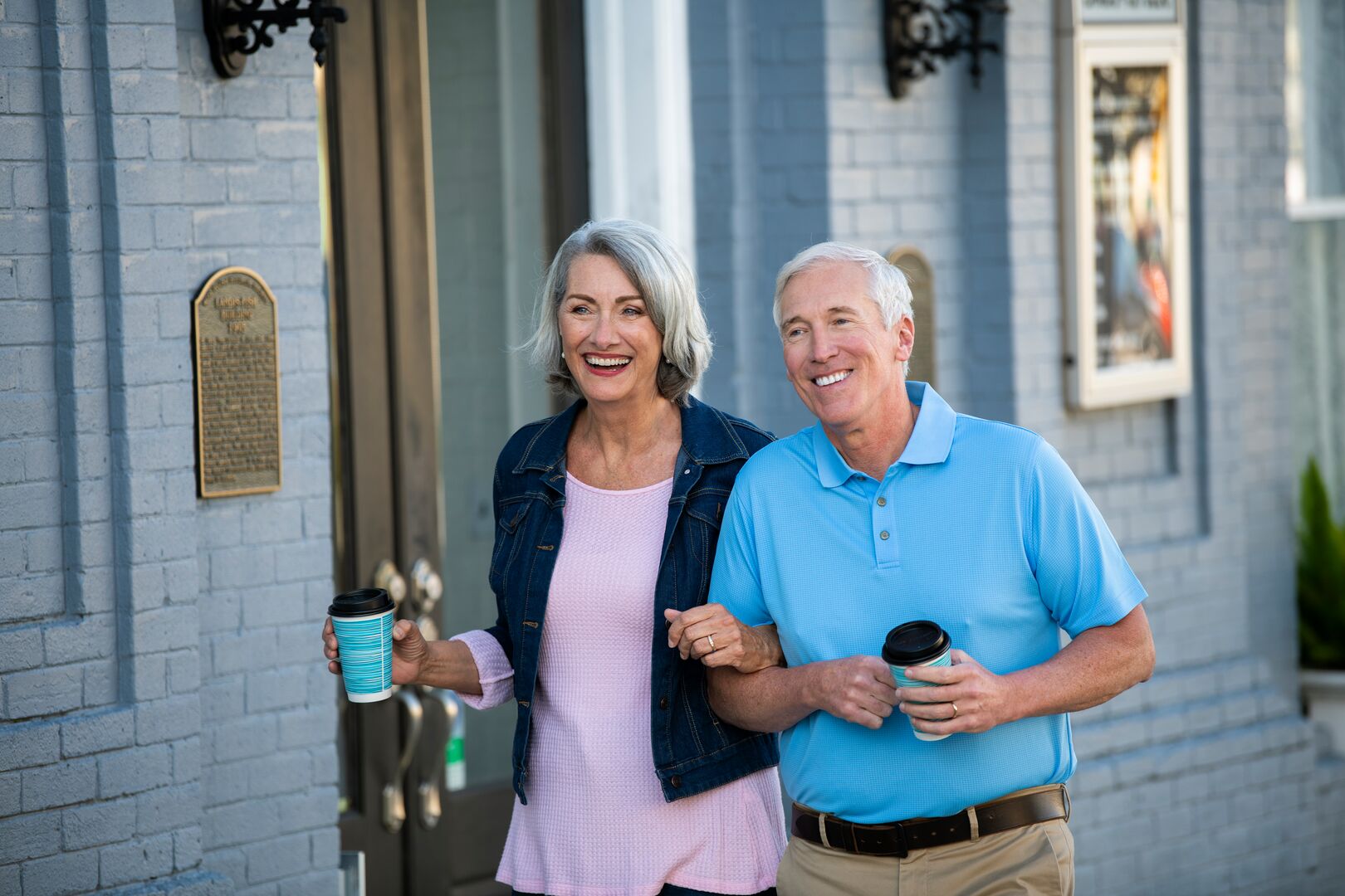 Couple walking down sidewalk